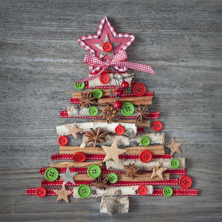 Christmas tree made of natural materials on wooden background